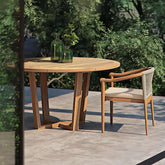 7-piece teak dining set with round table and 6 natural chairs